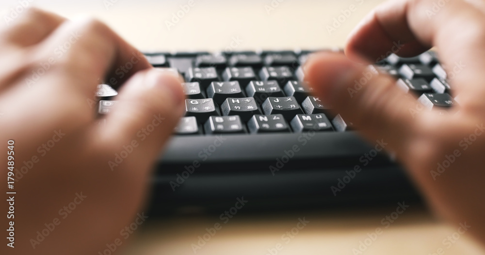 Man hands typing on a computer keyboard Man hands typing on a computer keyboard