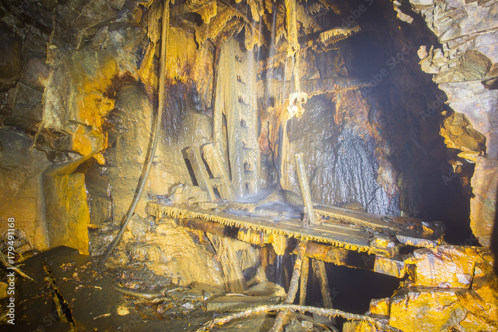Ladder stairs in the underground underground ore mine shaft 