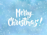 Merry Christmas text. Holiday greetings quote. Blue blurred background with falling snow effect.