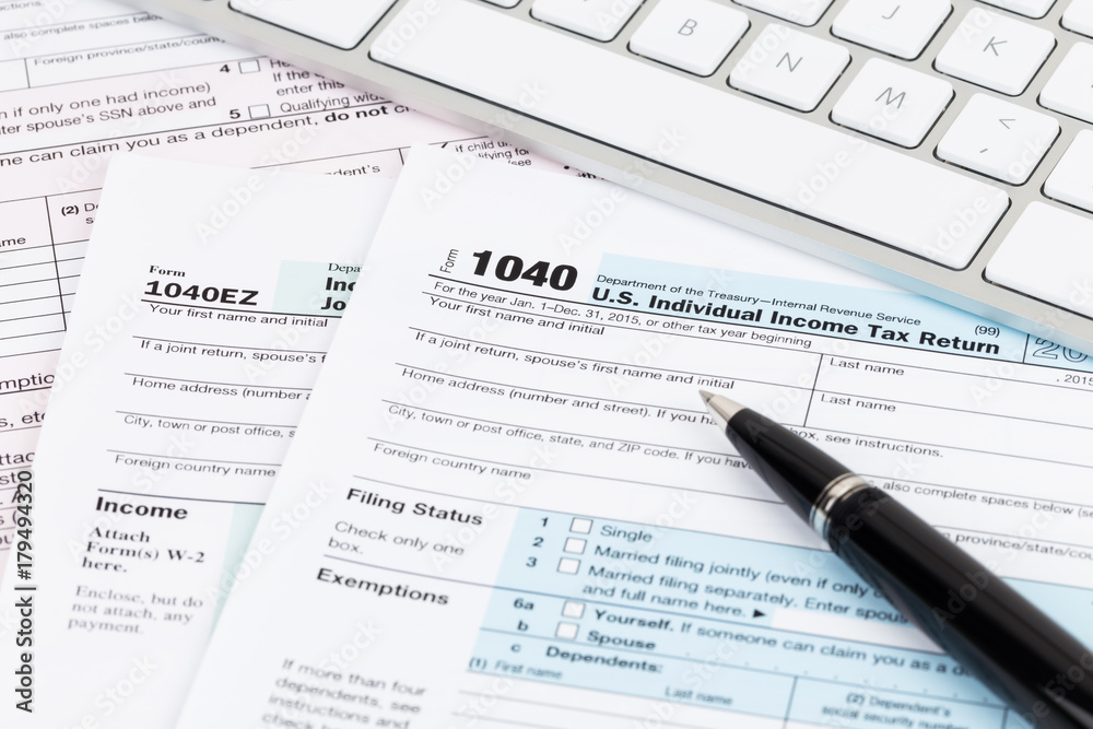 Tax form with keyboard, and pen Tax form with keyboard, and pen