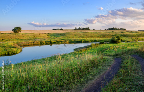Sunny summer landscape.River Upa in Tula region,Russia.Ground country road. 