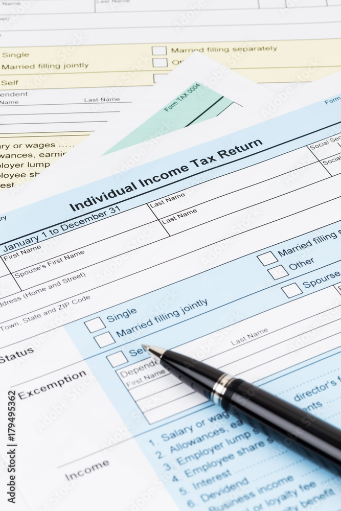 Tax form with pen; document are mock-up Tax form with pen; document are mock-up