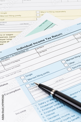 Tax form with pen; document are mock-up