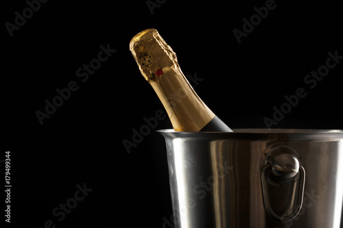 Champagne bottle on a black background