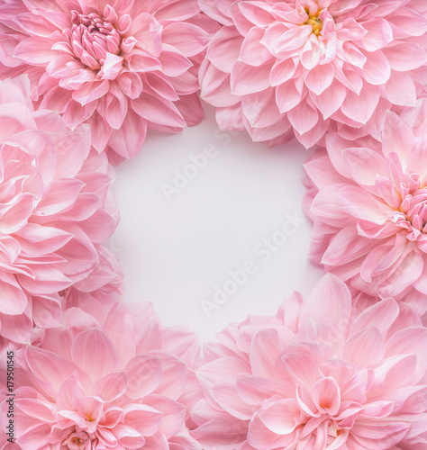 Creative pastel pink flowers frame, top view. Layout or greeting card for Mothers day, wedding or happy event