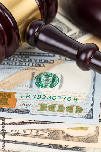 Schilderij op canvas Judge wooden gavel with dollar money banknote concept for bribery