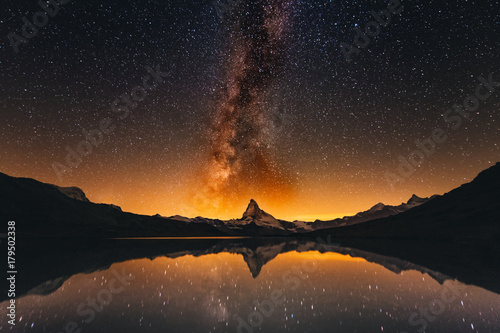 Milky way at lake Stellisee Matterhorn  , Zermatt , Switzerland. © exzozis