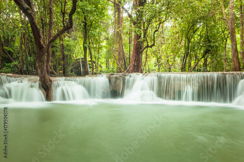 Green nature with green waterfall landscape  Erawan waterfall located Khanchanaburi Province  Thailand