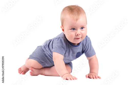 Portrait of smiling baby boy isolated on white background.