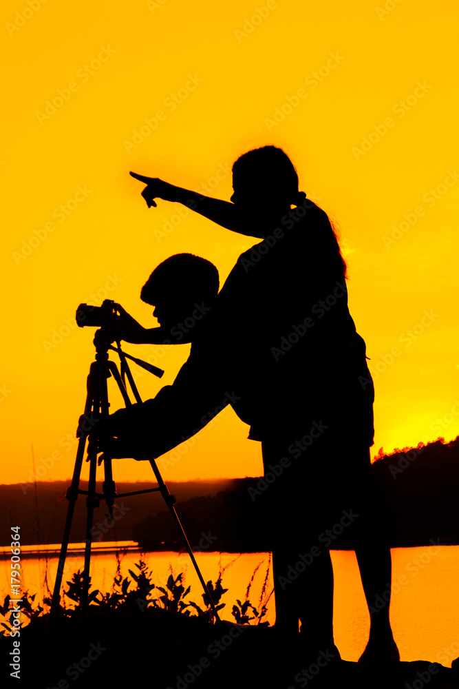 Silhouette women taking pictures nature landscape.