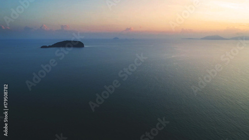 Aerial view. A tiny island viewed during sunrise.