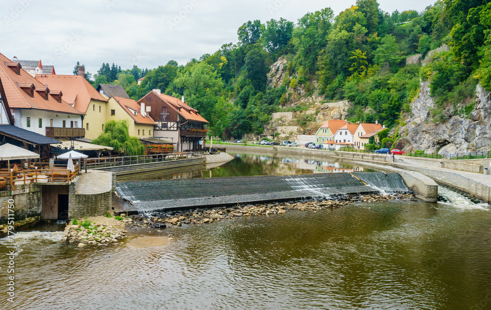 A small dam on the Vltava river in Cesky Krumlov, in the Czech Republic near the mill in September A small dam on the Vltava river in Cesky Krumlov, in the Czech Republic near the mill in September