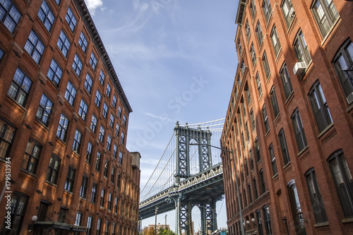 Brick wall buildings and Manhattan Bridge in Brooklyn New York City, United States