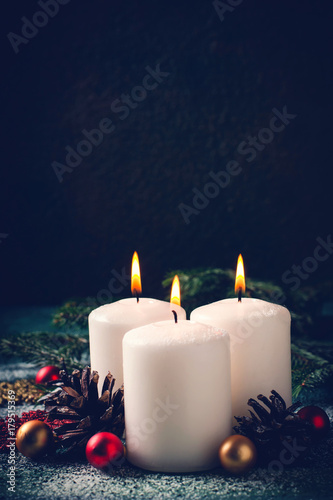 Christmas card with burning candles and decorations