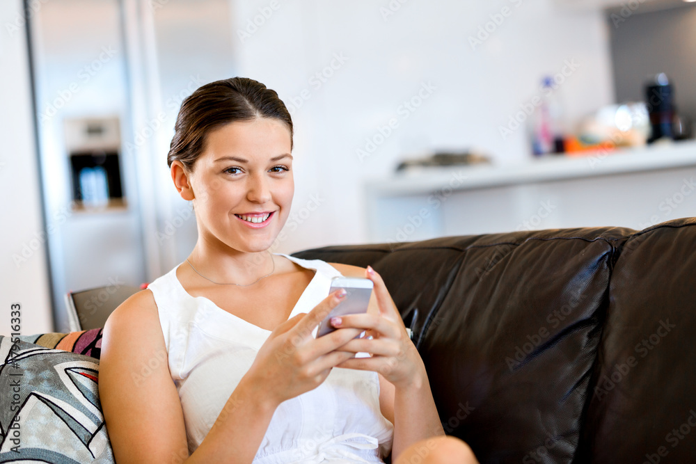 Portrait of young woman holding phone Portrait of young woman holding phone