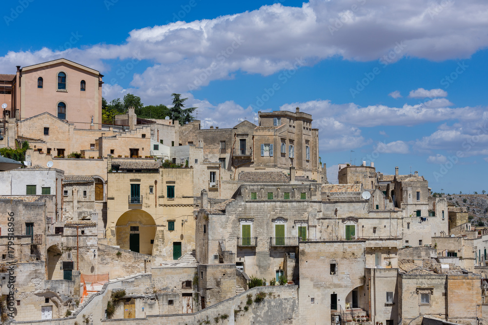 Panoramic view of the ancient town of Matera (Sassi di Matera), European Capital of Culture 2019, under blue sky, Basilicata, southern Italy