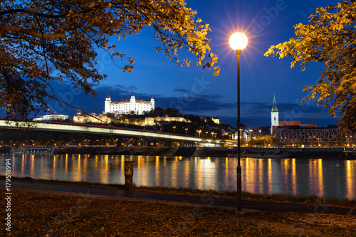 Night view of Bratislava and Danube river on an autumn day photo