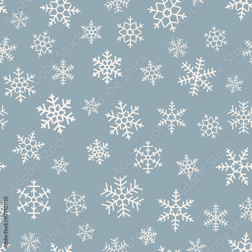 Seamless simple pattern of different blue geometric snowflakes