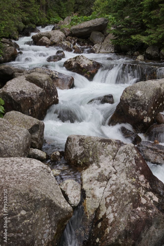 Nature in High Tatras in Slovakia. Mountains of rocky rocks cliffs and waterfalls suitable as background pictures of wishes, banners. Nature in High Tatras in Slovakia. Mountains of rocky rocks cliffs and waterfalls suitable as background pictures of wishes, banners.