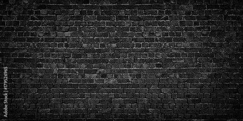 dark brick wall as a backdrop. brickwork design element