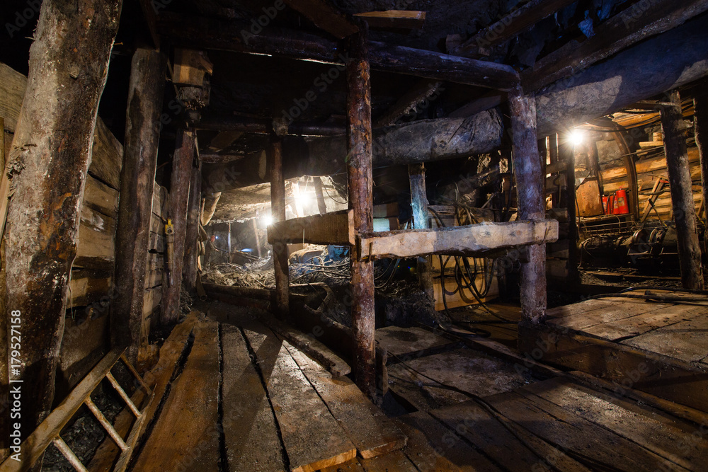Underground emerald ore mine shaft tunnel gallery passage with light Underground emerald ore mine shaft tunnel gallery passage with light