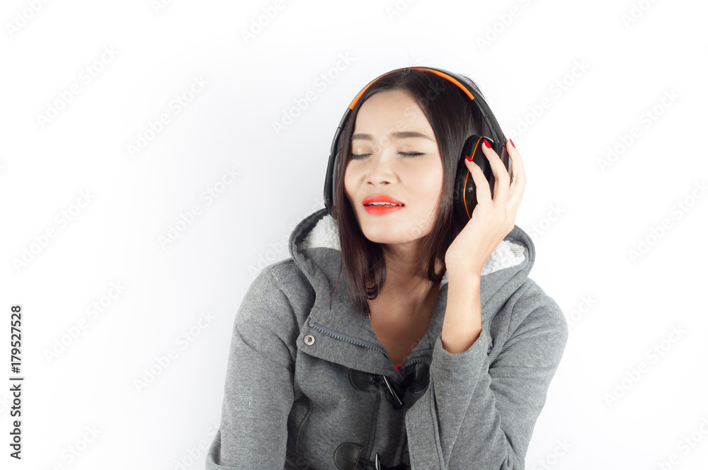 Beautiful asian girl from Thailand sing song from Headphones on white background Beautiful asian girl from Thailand sing song from Headphones on white background