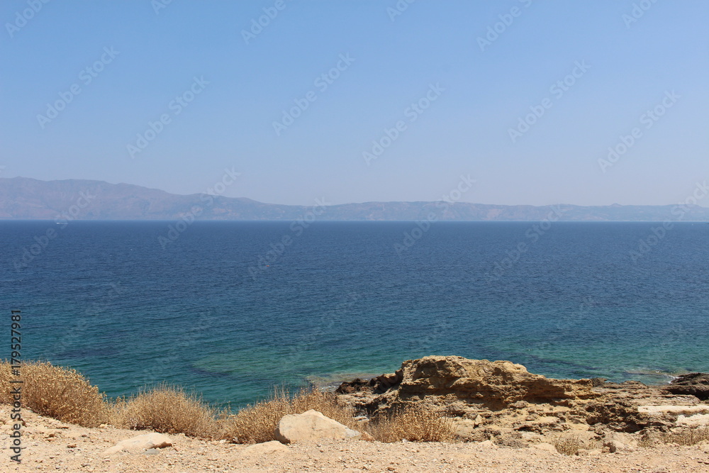Blue Mediterranean Sea and Rodopos peninsula, taken from the Balos peninsula, near Kissamos in Chania prefecture, Crete Island, Greece. Blue Mediterranean Sea and Rodopos peninsula, taken from the Balos peninsula, near Kissamos in Chania prefecture, Crete Island, Greece.