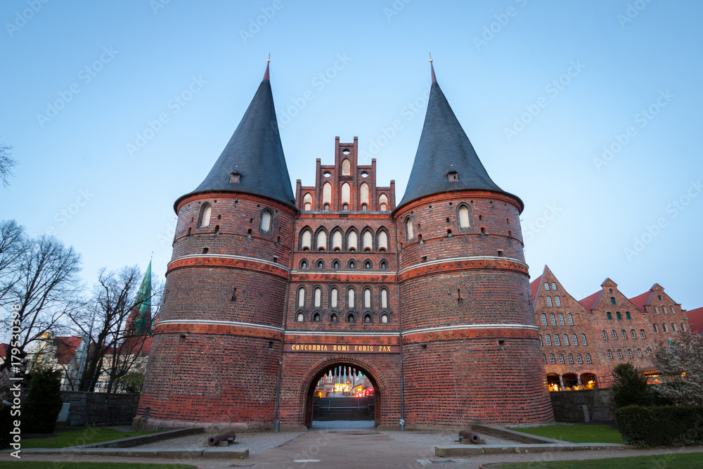 Holstentor Gate during twilight in Lubeck, Germany