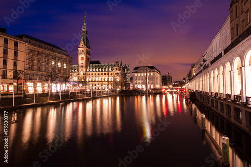 Town hall of Hamburg in Germany during twilight  reflection of light on water in canal