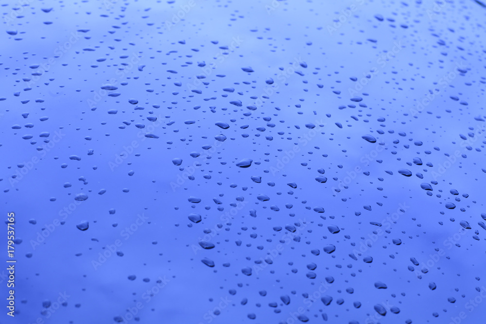 Waterdrop on glass with reflection of blue sky. Waterdrop on glass with reflection of blue sky.