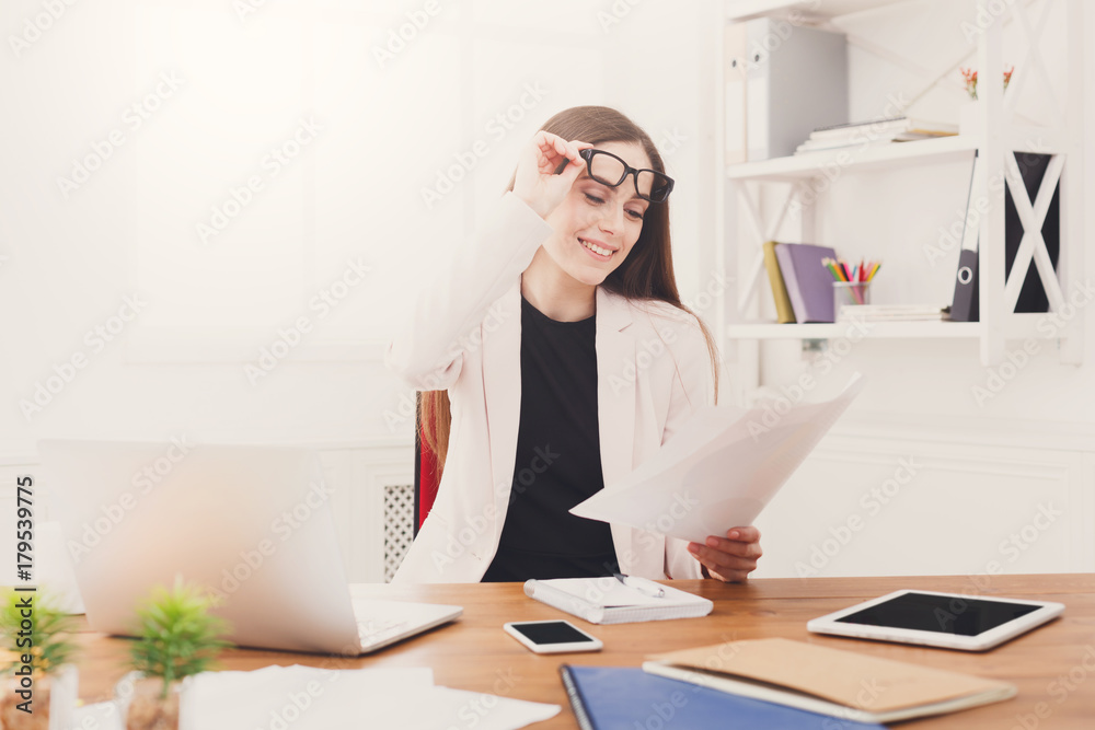 Business woman reading document at office Business woman reading document at office