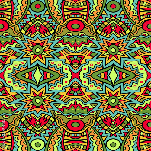 Festive tribal pattern in bright colors. Aztec style seamless ethnic ornament.