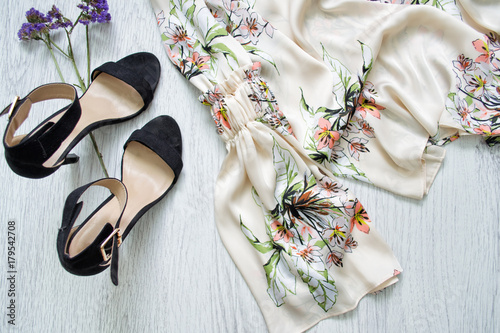 Sleeve flower blouse, black shoes shoes. Fashionable concept.