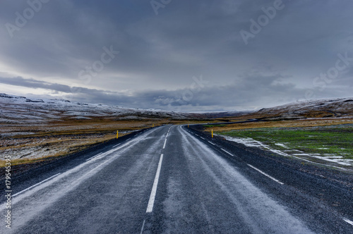 Empty Street with Icelandic Landscape during Sunrise Golden Hour