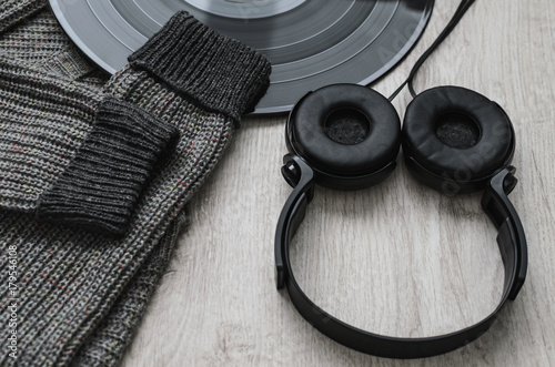Composition, woolen sweatshirt black headphones and a large vinyl record