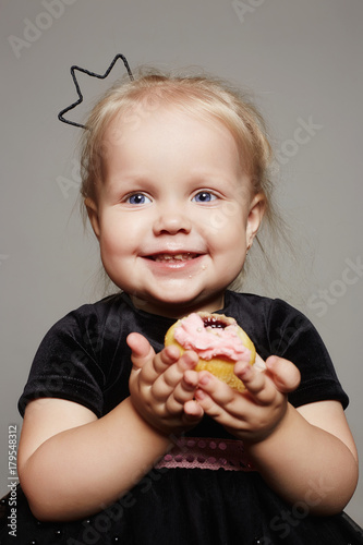 smiling baby child with a cake