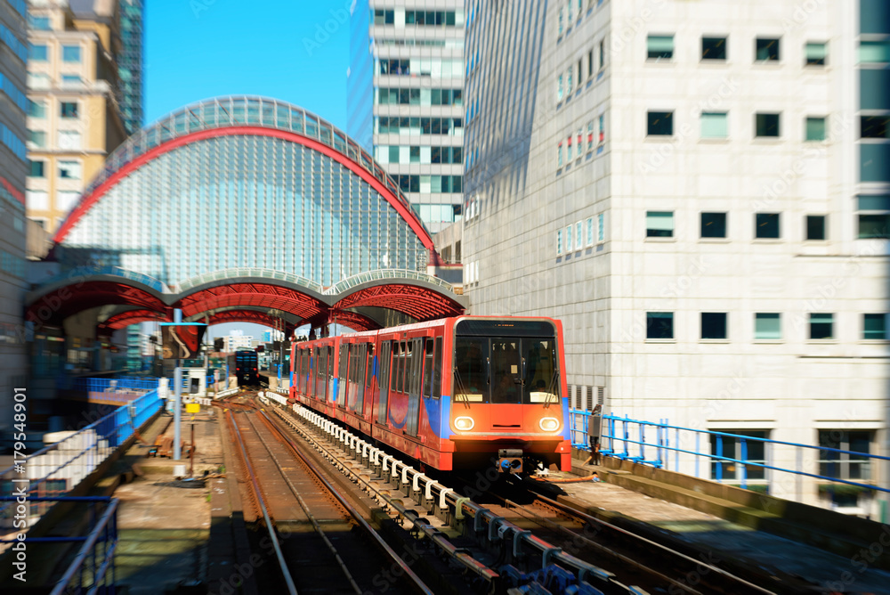 Naklejka premium Train leaving station in London Canary Wharf