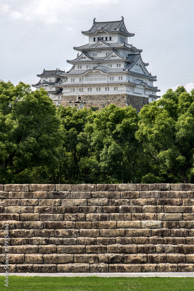 Staircase in park with Osaka castle on the horizon, Japan.