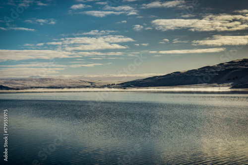 Iceland Winter view across Atlantic Ocean towards Snow Capped Mo