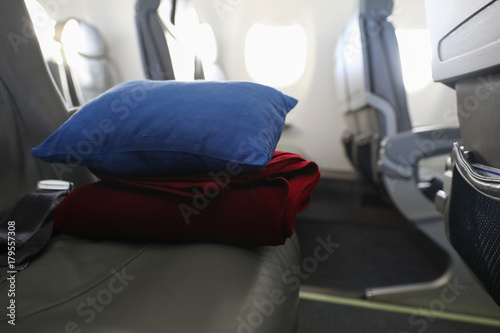 Foto Pillow and blanket lying on the seat in the plane