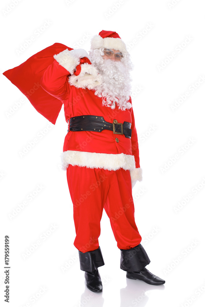 Santa Claus carrying big bag. Isolated on white background. Full length portrait Santa Claus carrying big bag. Isolated on white background. Full length portrait