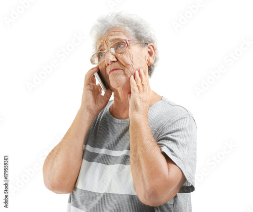 Elderly woman speaking on c...