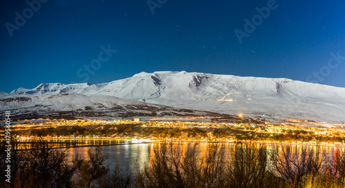 Photos Panoramic view on Akureyri city night in winter with snow at nig