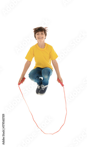 Cute little boy jumping rop...