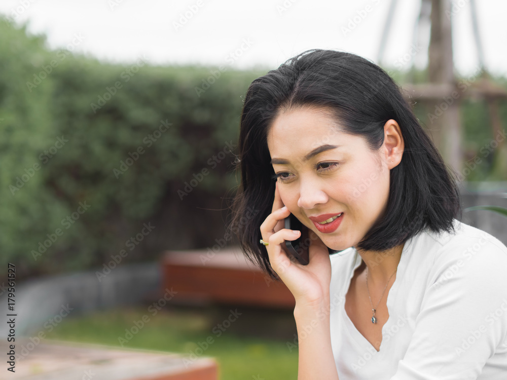Happy woman got good news on the phone. Happy woman got good news on the phone.