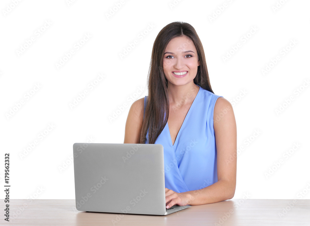 Beautiful young woman with modern laptop at table on white background Beautiful young woman with modern laptop at table on white background