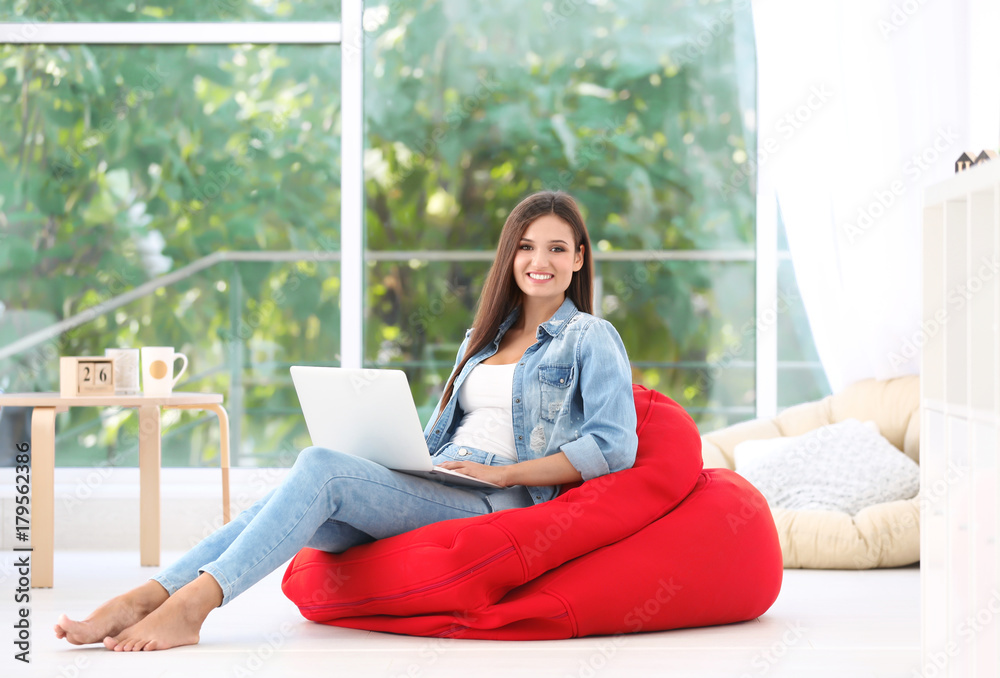 Beautiful young woman with modern laptop at home Beautiful young woman with modern laptop at home