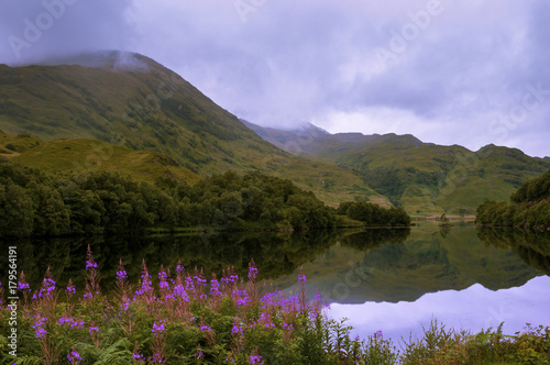 Beautiful and serene landscape of a lake and mountains in the Highlands of Scotland, United Kingdom  Concept for travel in Scotland © Tiago Fernandez
