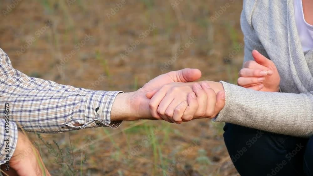 Slow movement of the hands of lovers, men and women. The hands of a man and a woman are united in a single whole. The concept of family and love. Slow movement of the hands of lovers, men and women. The hands of a man and a woman are united in a single whole. The concept of family and love.