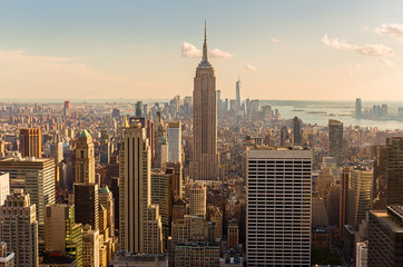 Wandcirkels Empire State Building Verlichte wolkenkrabbers Midtown bij zonsondergang  © peresanz